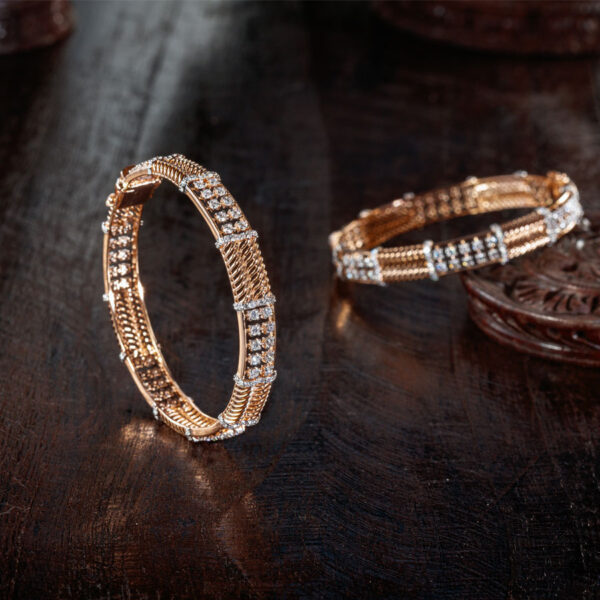Diamond Bangles placed on a brown, wooden base