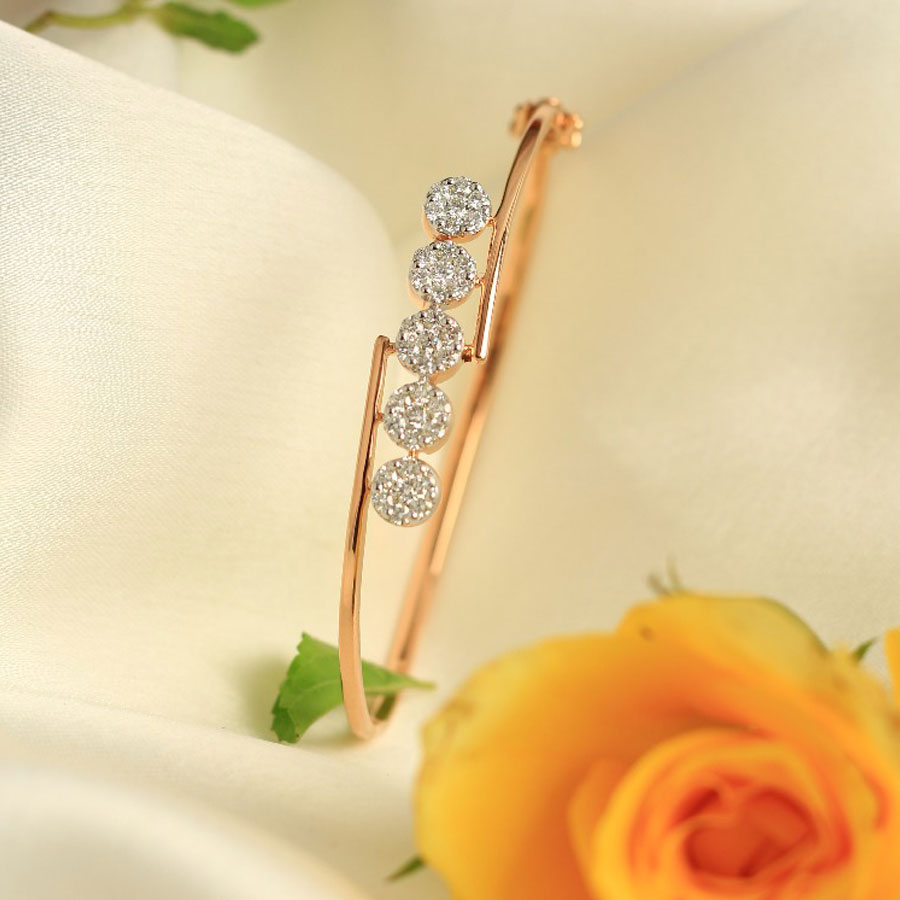 Miniature Rose Gold and Diamonds Bracelet on a white silk background