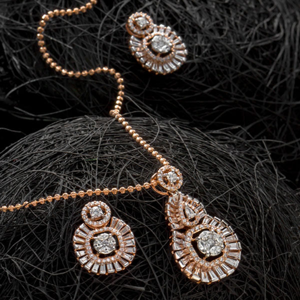 Hexagonal Rose Gold and Diamond Earrings on a dark background
