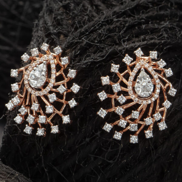 Dewdrop Diamond Earrings on a dark background