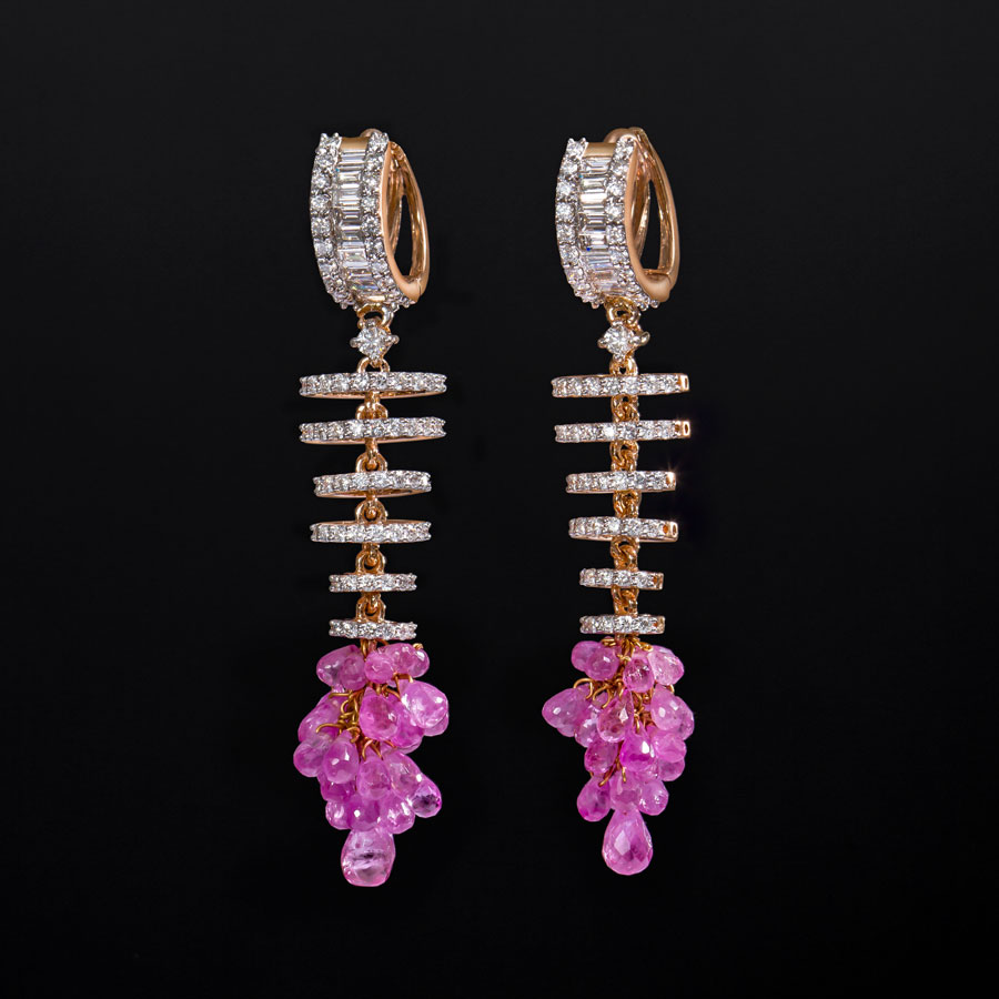 Diamond and Rose Gold Pearly Earrings on a black background