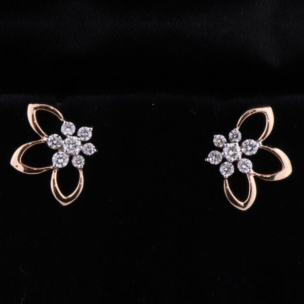 Lily Shaped Rose Gold and Diamond Earrings on a black background