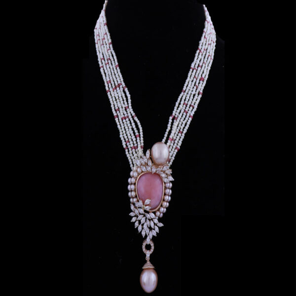 Baby Pink Pearls and Diamond Necklace on a black background